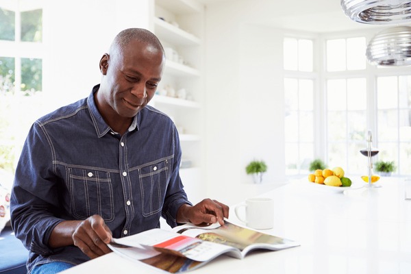 Home african american man reading magazine 600nw 165823148